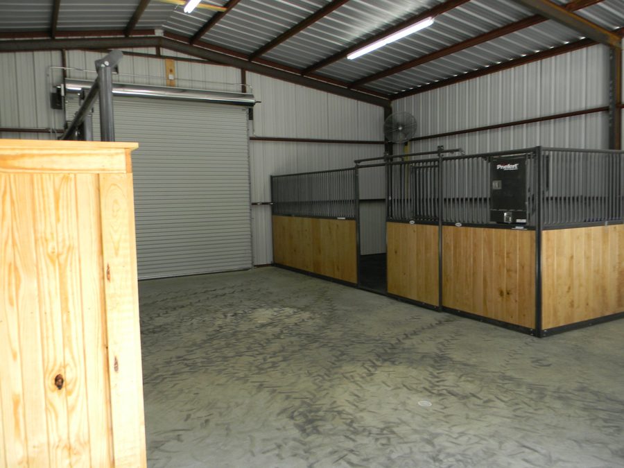 Horse barn construction — custom carpentry and concrete floors, East Texas