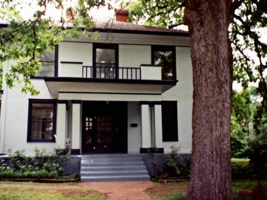 Exterior painting project after — white two-story home, East Texas